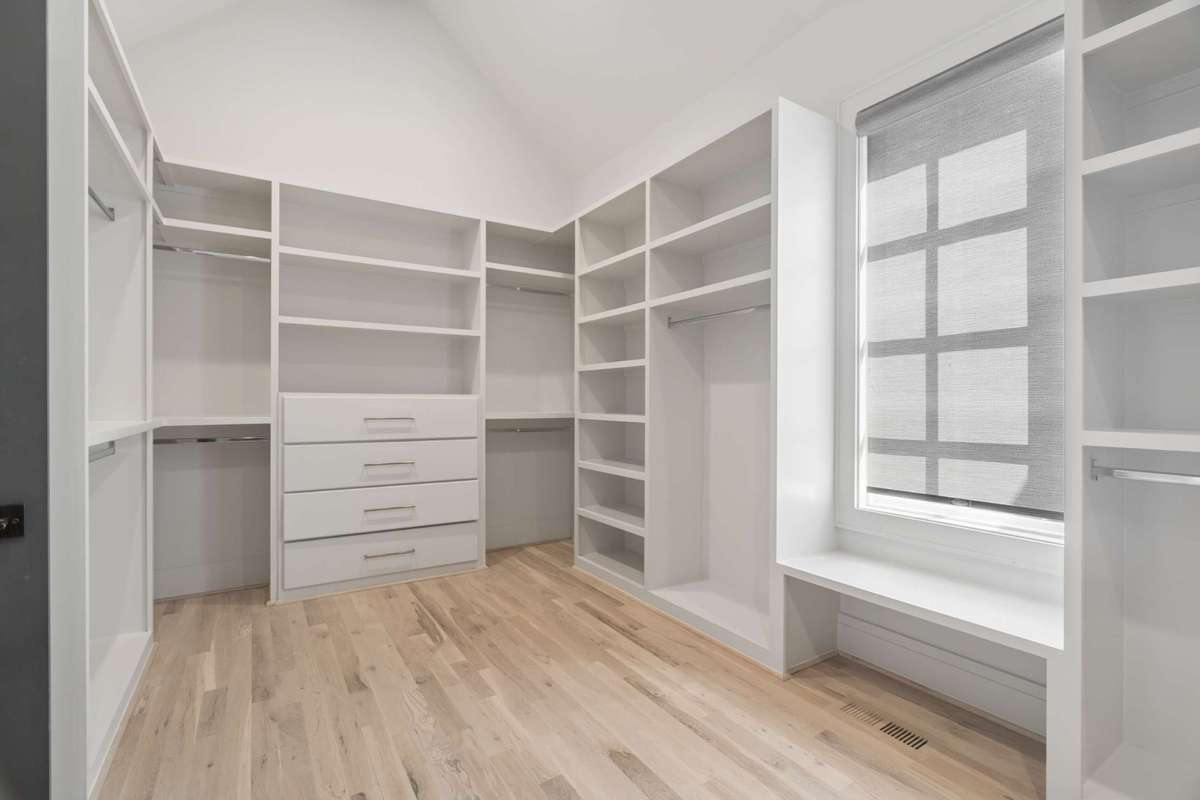 Primary closet with full sized washer/dryer