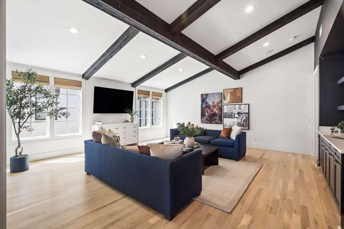 Upstairs bonus room with vaulted ceilings and wet bar