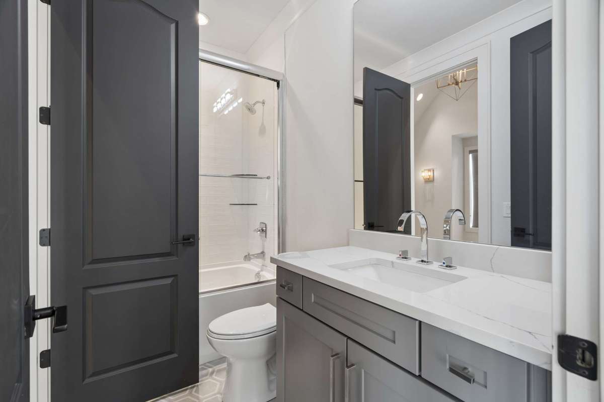 En suite bath that also serves bonus room