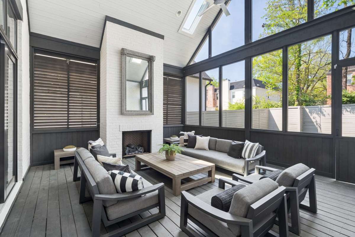 Beautiful screen porch with vaulted ceilings and gas burning fireplace