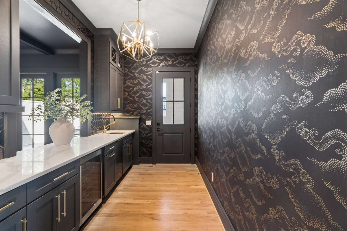 Wet bar adjacent to dining room, with direct access to exterior dining patio