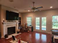 House has many Upgrades including Beautiful Hardwood Floors and Cozy Fireplace in Living Room.