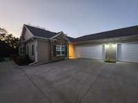 Attached 2 Car Garage with Extra Parking Space.