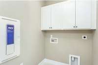 Photo of Contour Model Home's Laundry Room. Actual colors & selections may vary.