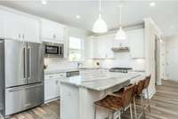 Photo of Contour Model Home's Kitchen. Actual colors & selections may vary.