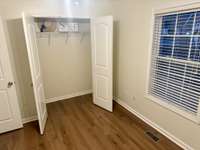 One of three bedrooms with closet