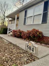 Covered front porch keeps guests dry during the rainy season- excellent for early evenings, sitting out front with a glass of cold iced tea