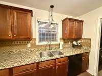 Kitchen window overlooks the back deck