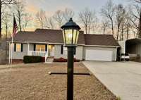 Stunning home situated on the largest lot in Greenfield Ridge subdivision! Plenty of parking for an RV or several cars two car garage and also a covered carport! Bring your boat, your RV, etc. Great Home for your retirement or starting new!