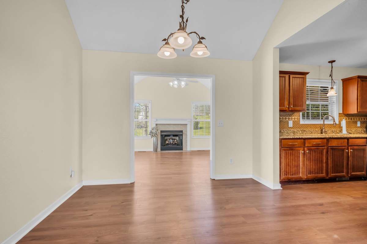 DINING ROOM OUTSIDE KITCHEN LOOKING INTO SECOND LIVING ROOM/DEN