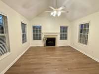 Den with fireplace, the area to the right has the French door leading to the back deck