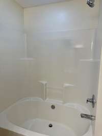 Owners bathroom has large tub