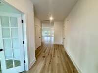 Entering into the home through the 8 foot door into the spacious foyer