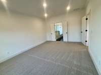 Primary bedroom down- double doors lead to a retreat