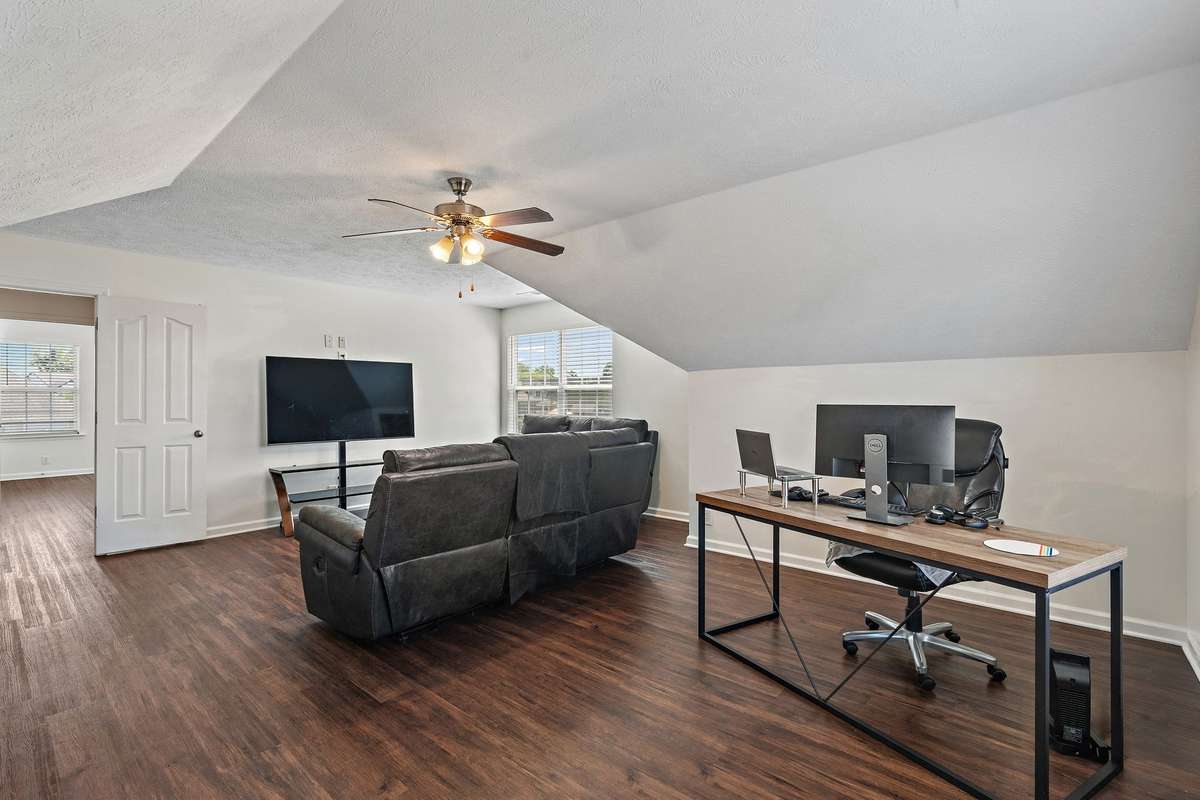 Bonus room also doubles as office space.