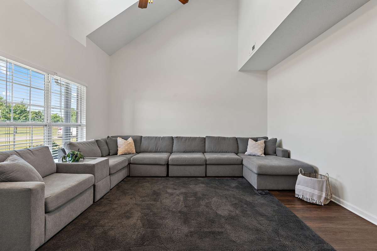 Large, open living room with vaulted ceilings.