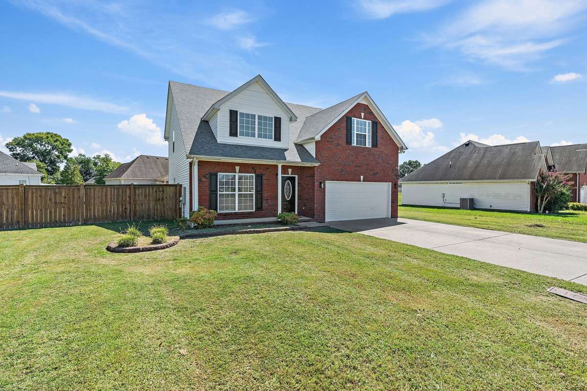 Enjoy outdoor living on the covered front porch overlooking the lush front yard.