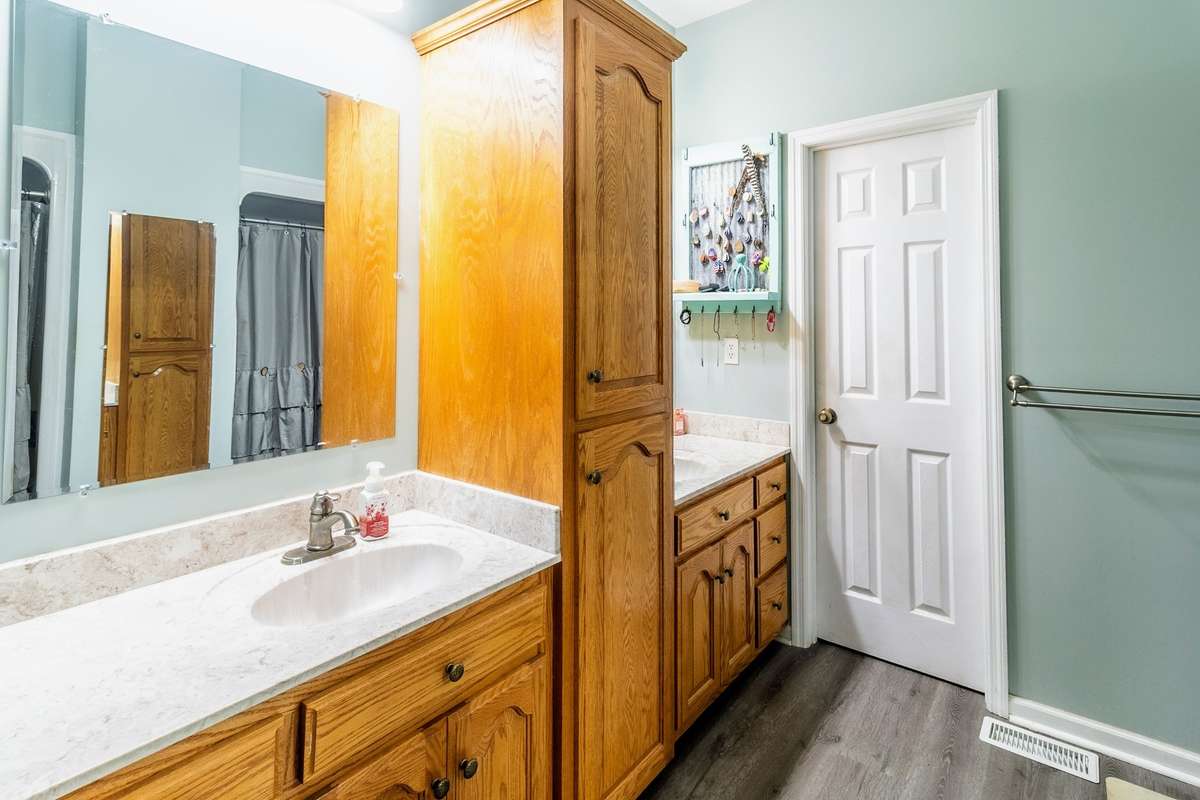 Doube vanity bathroom with another large closet inside