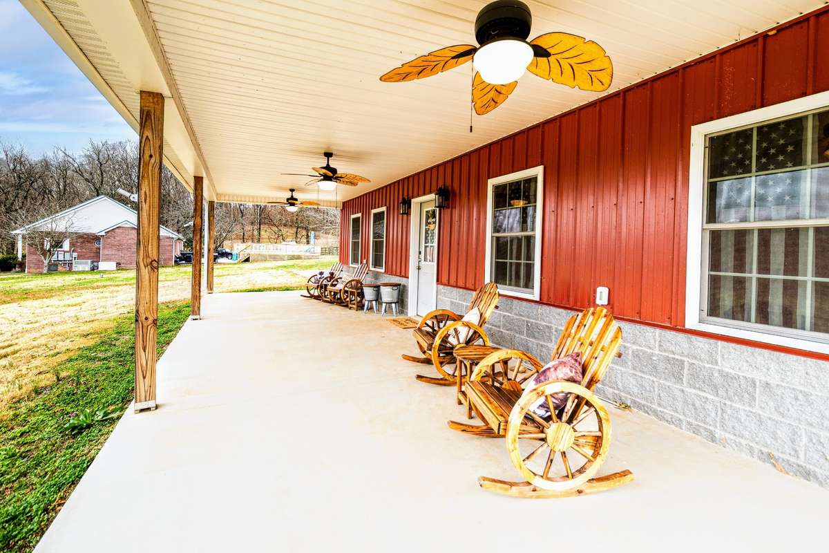 Front porch to garage/sportsbar with a huge front porch to admire the views