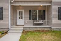 Covered Front Porch + Concrete Sidewalk