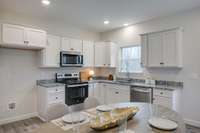 LUXE Kitchen featuring Upgraded Cabinetry + Full Granite Package