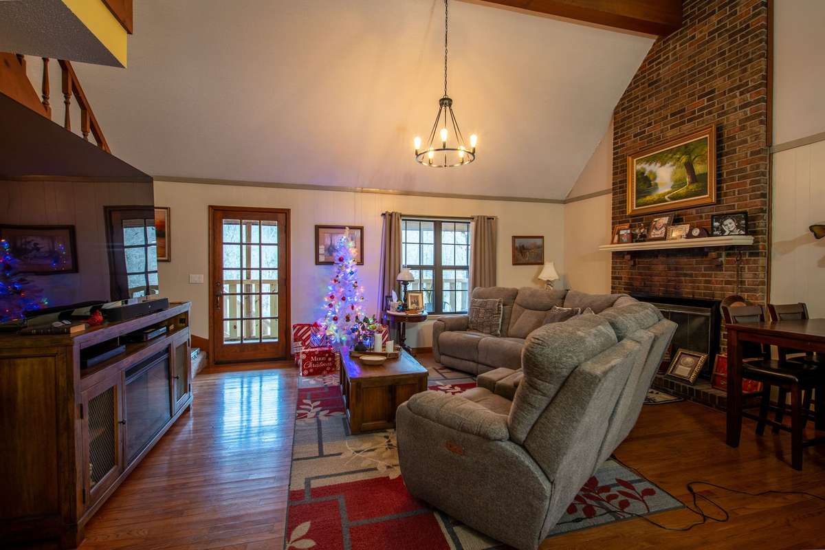 Cathedral ceiling with wood burning fireplace