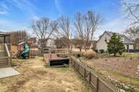 Property include land beyond fence line.  Backyard "toys"  can be left or removed.