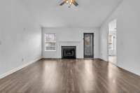 Wide plank flooring and vaulted ceilings welcome you in