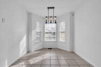 Eat-in Kitchen with a bay window overlooking the backyard.