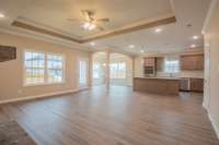 EXAMPLE>>>Living Room is Open to the Kitchen and has Access to the Covered Patio!!