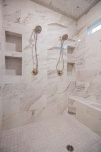 EXAMPLE>>>Huge Tile Shower with a Bench Seat, TWO Shower Heads, a Top Window for Natural Light and a Window Overlooking the Tub!