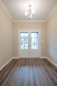EXAMPLE>>>Spacious Entry Foyer with French Doors, Wood Flooring, and an Elegant Chandelier!