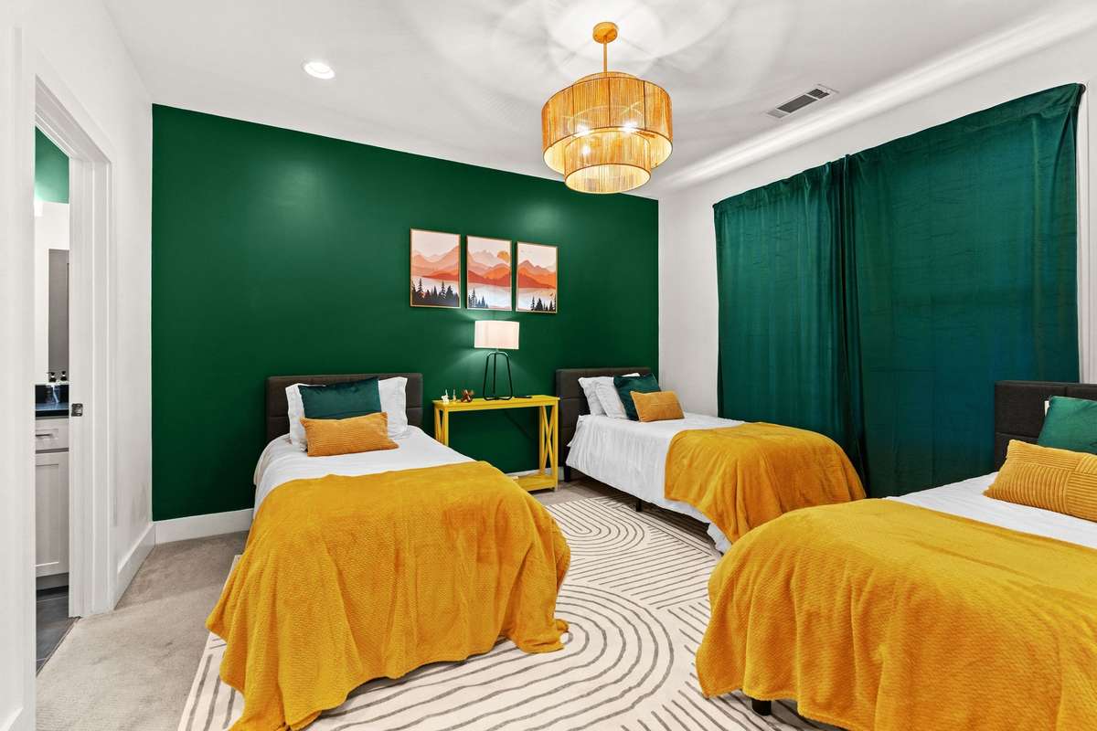 Versatile bedroom, ideal for multiple guests with its own bathroom.