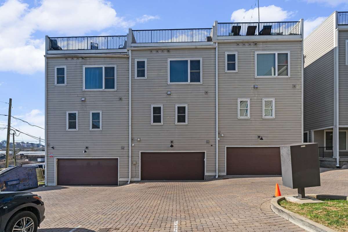 Rear exterior showing garage access.