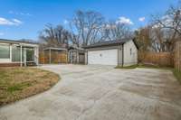 Oversized driveway and tons of parking leading to detached garage, carport and storage building all behind your new extra tall privacy fence