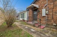 Side entry door leads through Laundry Room/Half bath area into kitchen.