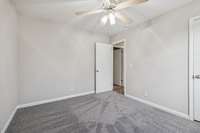 Secondary bedroom w/ ceiling fan