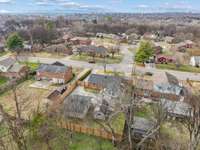 Lot backs into green space kept up by the city