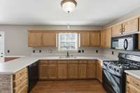 Kitchen with natural wood cabinets