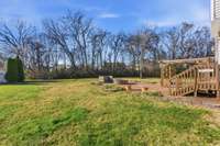 Expansive, level backyard offering endless possibilities