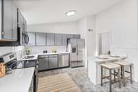 Huge Eat in kitchen complete with quartz counters and BRAND NEW appliances.