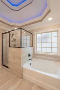 Large Soaker Tub and Beautiful Tile Shower with a Bench!