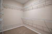 EXAMPLE>>>Huge Walk-in Closet with a Shoe Rack and Tons of Shelving! (Primary Bathroom, Will Have Wood Shelving)