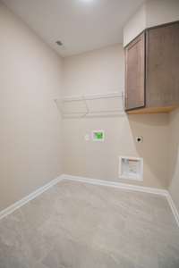 EXAMPLE>>>Spacious Laundry Room with Tile Flooring, Shelving and a Laundry Chute! (Will Have Cabinets instead of Shelving)