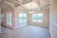 EXAMPLE>>>Spacious Formal Dining Room with Wainscoting, Crown Molding, Coffered Ceiling and Tons of Natural Lighting!