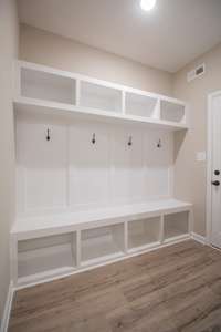 EXAMPLE>>>Mudroom off the Garage Features a Large Built-in Hall Tree!