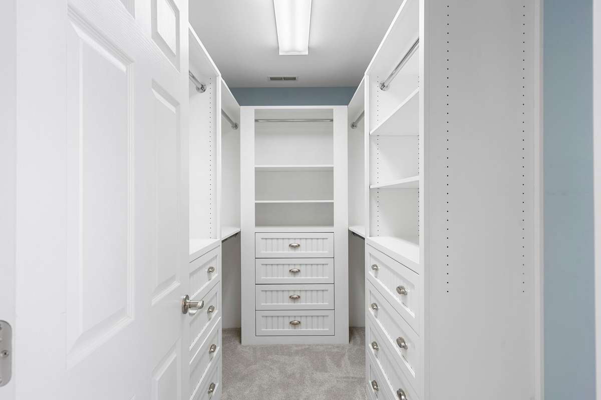 Custom closets in the Primary Bedroom offer numerous drawers and adjustable shelving -- perfect to suit every need!