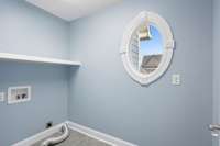 The upstairs Laundry Room is spacious and so very convenient to the bedrooms upstairs...and a beautiful window allows plentiful natural light!