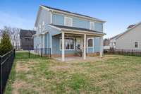 Another view showing the patio and the large back yard...