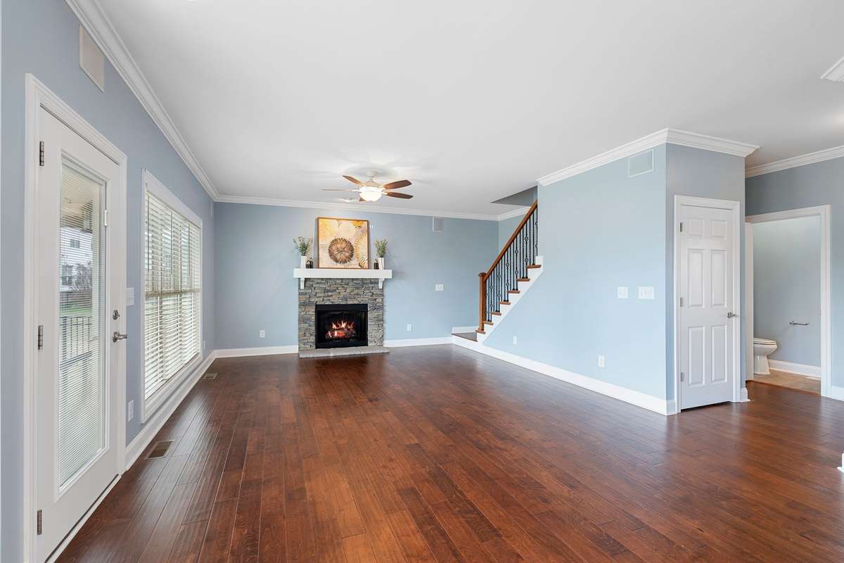 Another view of the living room...note the closet under the stairway. There are two more closets in this area which help provide ample storage space!